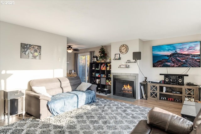 living room with ceiling fan and hardwood / wood-style floors