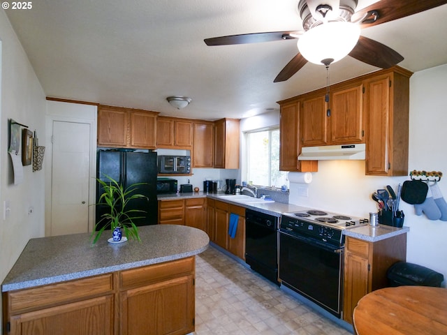 154 N 5th St, Saint Helens, OR 97051 - kitchen featuring black appliances, under cabinet range hood, a ceiling fan, light floors, and a sink