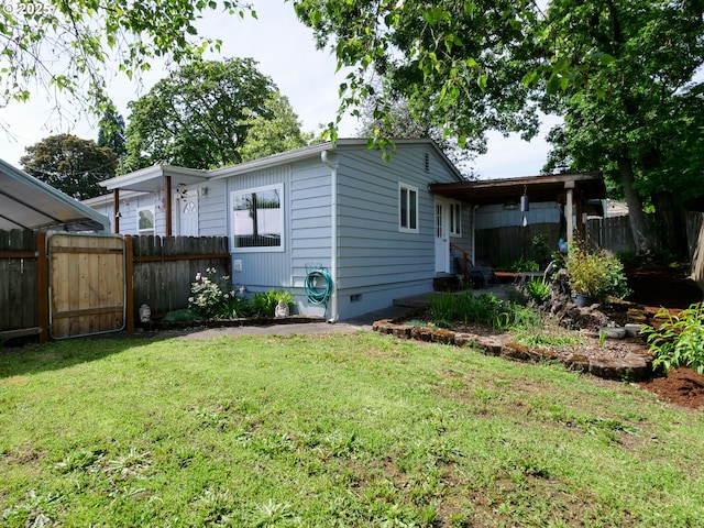 154 N 5th St, Saint Helens, OR 97051 - back of property featuring crawl space and a gate