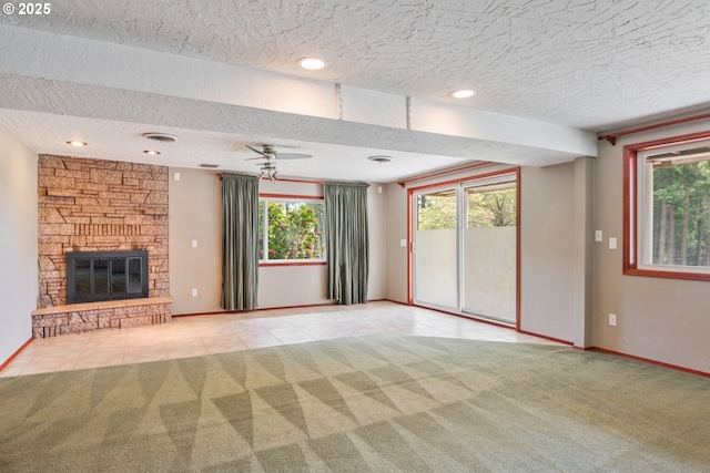 112 Paine Rd, Castle Rock, WA 98611 - unfurnished living room with a textured ceiling, carpet flooring, tile patterned floors, and plenty of natural light