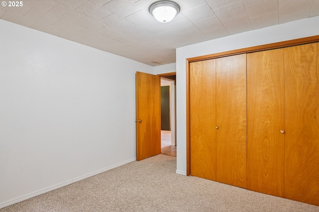 112 Paine Rd, Castle Rock, WA 98611 - unfurnished bedroom featuring carpet, a closet, and baseboards
