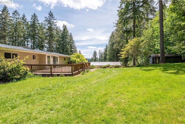 112 Paine Rd, Castle Rock, WA 98611 - view of green lawn with a deck