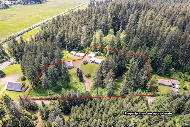 112 Paine Rd, Castle Rock, WA 98611 - aerial view of property and surrounding area featuring a heavily wooded area and property parcel outlined
