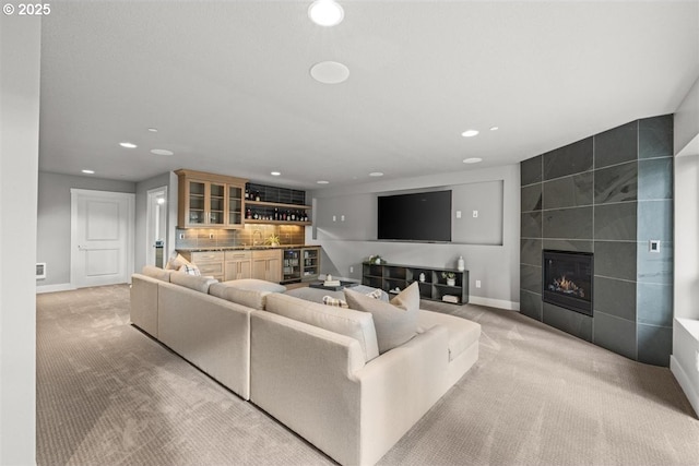 2193 NE 3rd Ave, Camas, WA 98607 - living room with wet bar, recessed lighting, light colored carpet, a tile fireplace, and beverage cooler