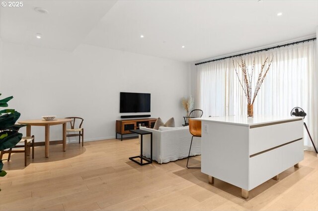 1150 NW Quimby St Unit 610, Portland, OR 97209 - living area with light wood-type flooring and recessed lighting