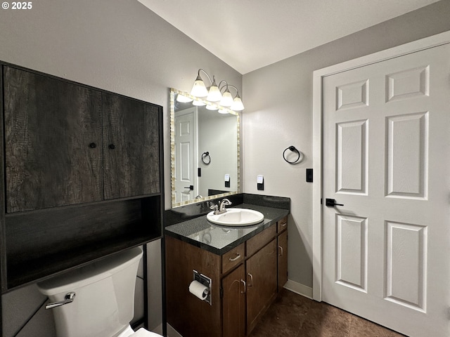 half bathroom with toilet and vanity