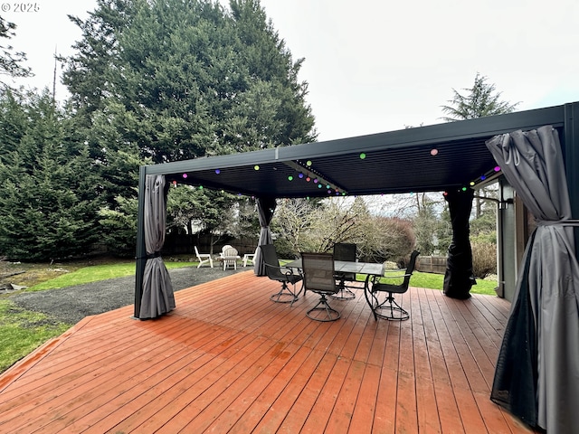 wooden deck featuring outdoor dining space