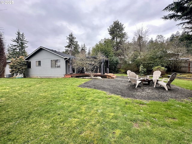 view of yard with a fire pit and a wooden deck