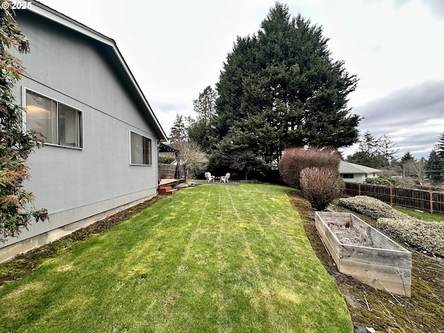 view of yard featuring a garden and fence