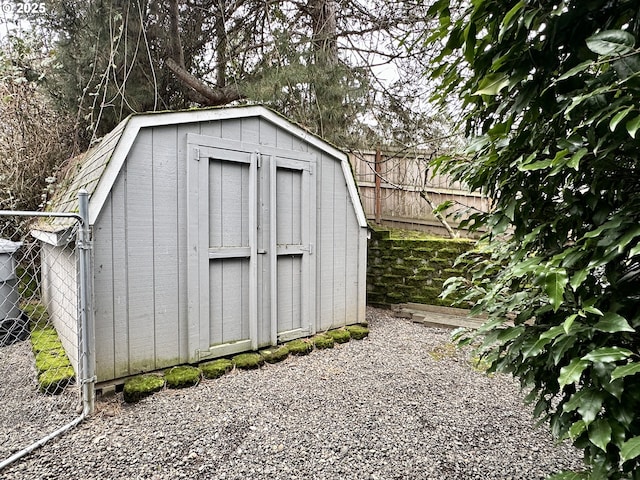 view of shed with fence