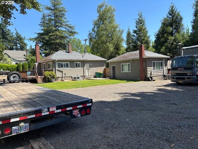 4535 SW Laurelwood Ave, Portland, OR 97225 - view of front facade featuring a deck and a chimney