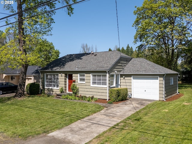 view of front of property featuring a garage, a shingled roof, a front lawn, and concrete driveway