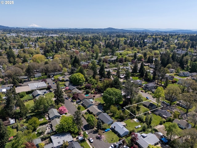 drone / aerial view featuring a mountain view and a residential view