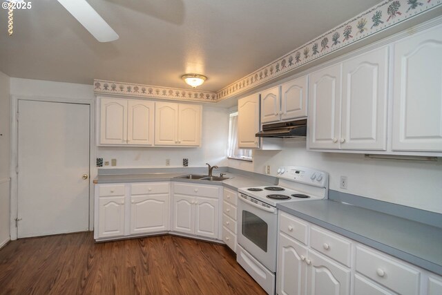 kitchen with white range with electric cooktop, under cabinet range hood, a sink, white cabinetry, and dark wood-type flooring