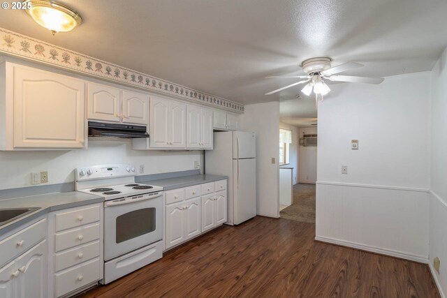 kitchen featuring white appliances, under cabinet range hood, ceiling fan, white cabinetry, and dark wood-style flooring