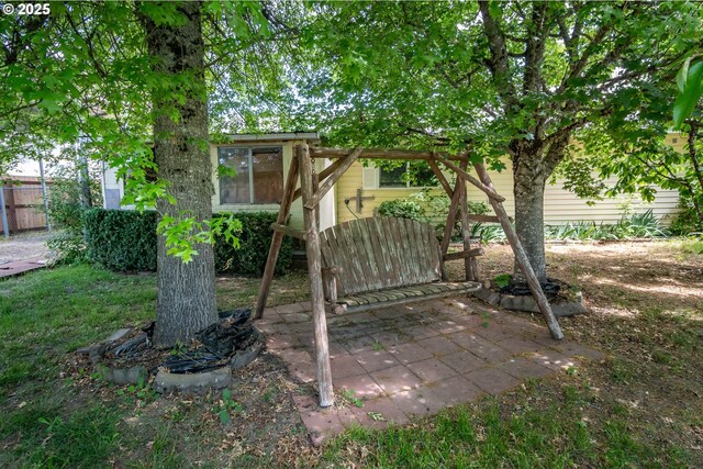 view of yard featuring a patio and fence