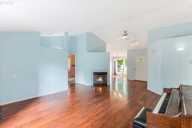 10406 NE 88th St, Vancouver, WA 98662 - living room with a ceiling fan, a tile fireplace, wood finished floors, and high vaulted ceiling