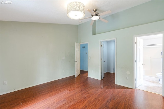 10406 NE 88th St, Vancouver, WA 98662 - unfurnished bedroom featuring a walk in closet, wood finished floors, high vaulted ceiling, and a closet