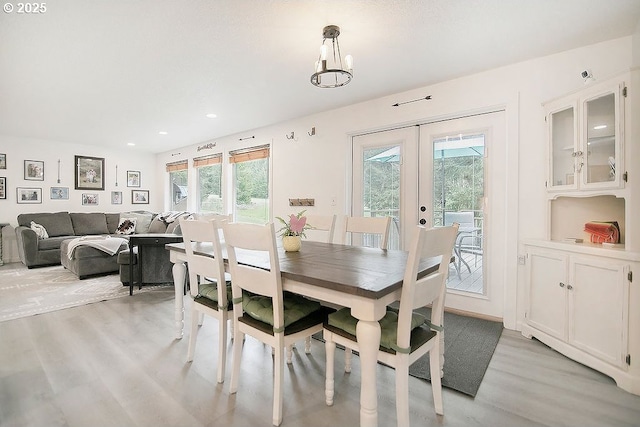 dining area featuring light wood-type flooring, french doors, and recessed lighting