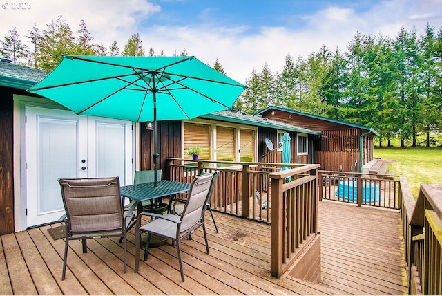 wooden deck featuring outdoor dining space