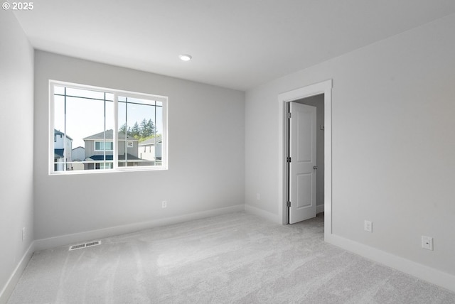 7864 NW Eleanor Ave, Portland, OR 97229 - spare room with baseboards, visible vents, and carpet