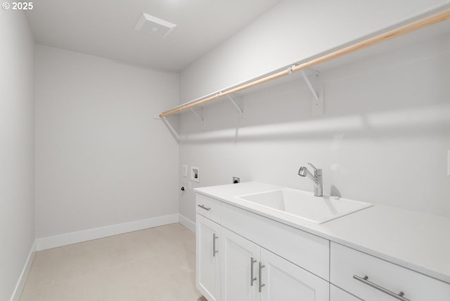 7864 NW Eleanor Ave, Portland, OR 97229 - laundry room featuring hookup for a washing machine, a sink, electric dryer hookup, cabinet space, and baseboards