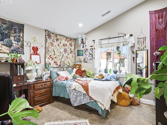 carpeted bedroom with lofted ceiling