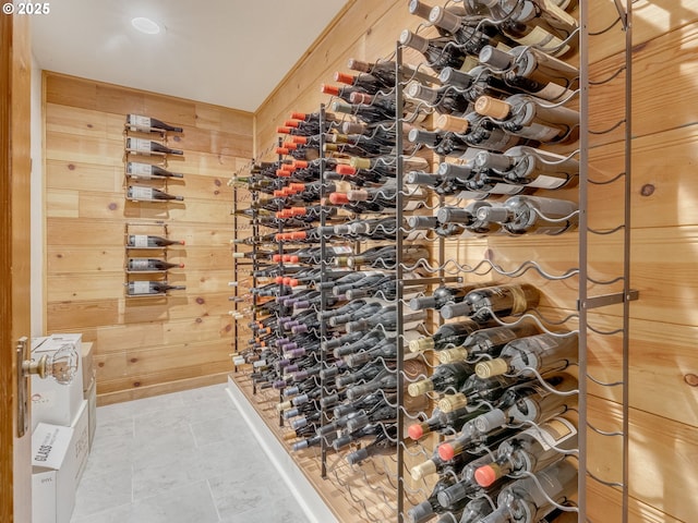wine area featuring wooden walls