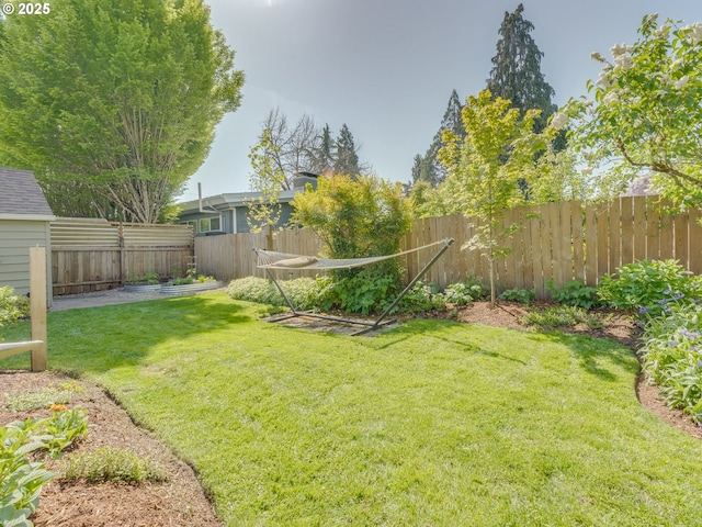 view of yard with a fenced backyard