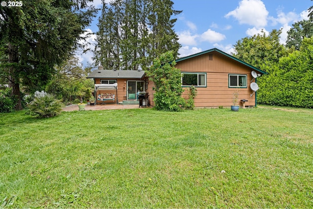8157 Thurston Rd, Springfield, OR 97477 - back of property with a patio area and a lawn