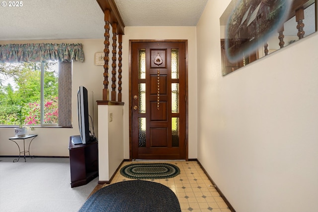 8157 Thurston Rd, Springfield, OR 97477 - entrance foyer with a textured ceiling, baseboards, and light floors