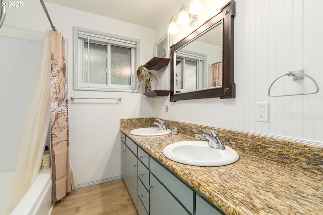 29536 Simmons Rd, Eugene, OR 97405 - full bathroom with double vanity, wood finished floors, and shower / bath combination with curtain