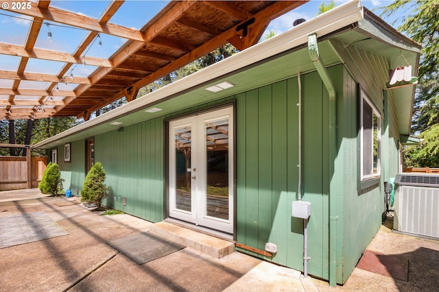 29536 Simmons Rd, Eugene, OR 97405 - exterior space featuring central AC, french doors, a pergola, a patio, and an outdoor structure