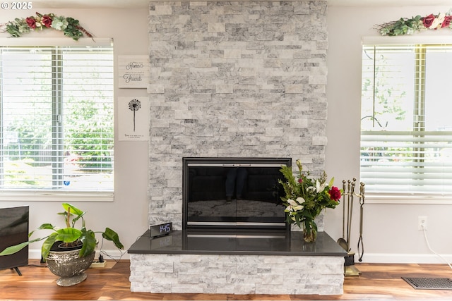 2416 SW 23rd Cir, Troutdale, OR 97060 - detailed view of wood finished floors, baseboards, and a fireplace