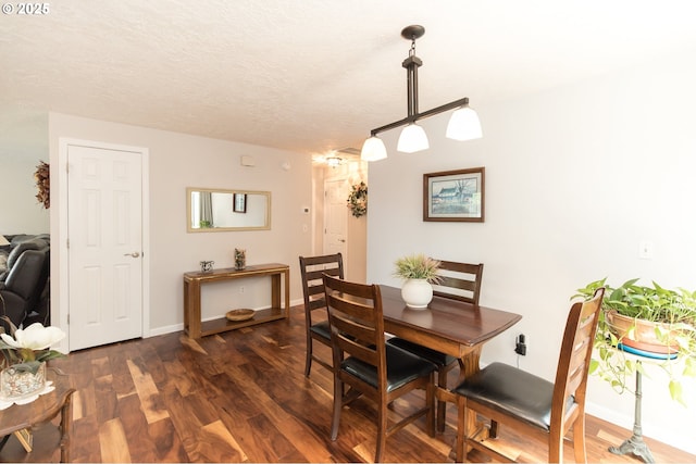 2416 SW 23rd Cir, Troutdale, OR 97060 - dining room with dark wood-type flooring, baseboards, and a textured ceiling