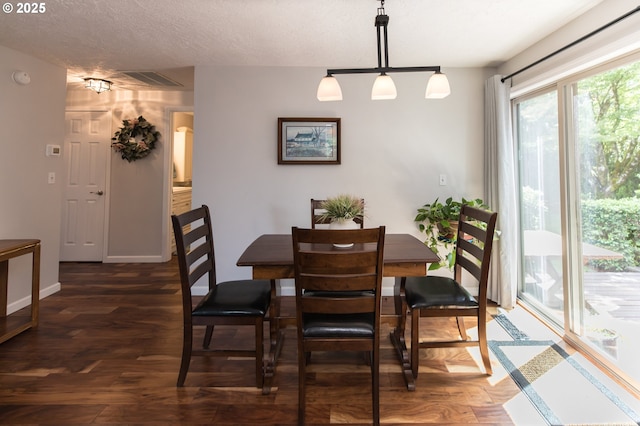 2416 SW 23rd Cir, Troutdale, OR 97060 - dining room featuring wood finished floors, baseboards, and a textured ceiling