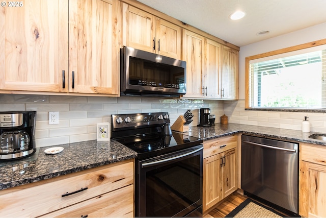 2416 SW 23rd Cir, Troutdale, OR 97060 - kitchen with stainless steel appliances, light brown cabinets, backsplash, dark stone countertops, and recessed lighting