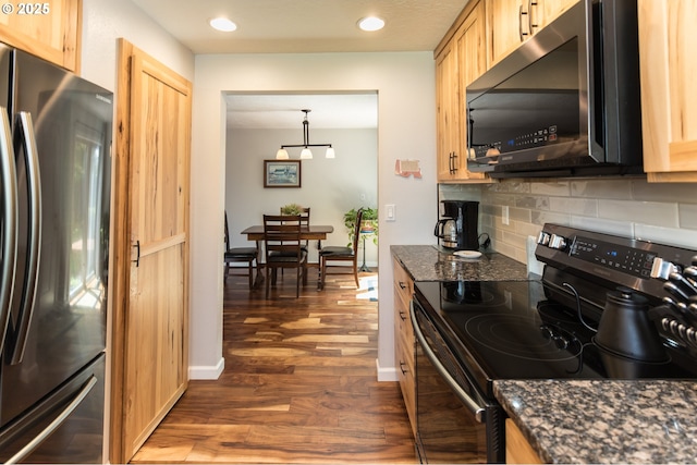 2416 SW 23rd Cir, Troutdale, OR 97060 - kitchen featuring appliances with stainless steel finishes, dark wood-style floors, backsplash, light brown cabinets, and dark stone countertops