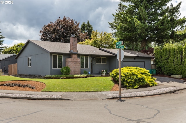 2416 SW 23rd Cir, Troutdale, OR 97060 - ranch-style house with an attached garage, a chimney, concrete driveway, and roof with shingles