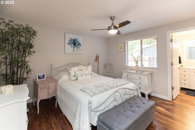 2416 SW 23rd Cir, Troutdale, OR 97060 - bedroom with wood finished floors, baseboards, connected bathroom, and ceiling fan