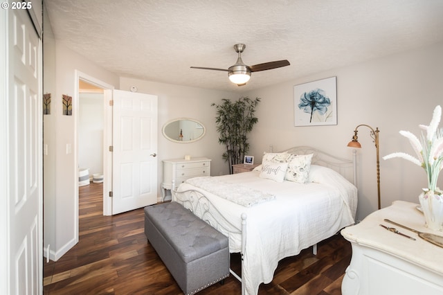 2416 SW 23rd Cir, Troutdale, OR 97060 - bedroom featuring dark wood finished floors, a ceiling fan, a textured ceiling, and baseboards