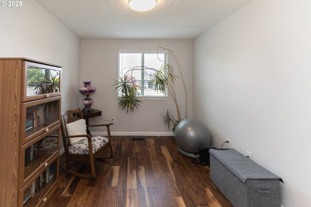 2416 SW 23rd Cir, Troutdale, OR 97060 - sitting room featuring wood finished floors, a textured ceiling, and baseboards