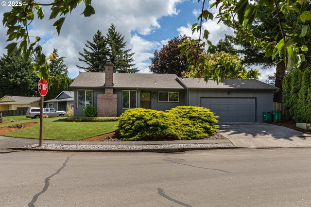 2416 SW 23rd Cir, Troutdale, OR 97060 - ranch-style house with an attached garage, a front lawn, driveway, and a chimney