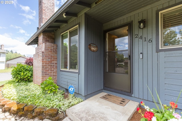 2416 SW 23rd Cir, Troutdale, OR 97060 - property entrance with a chimney and covered porch