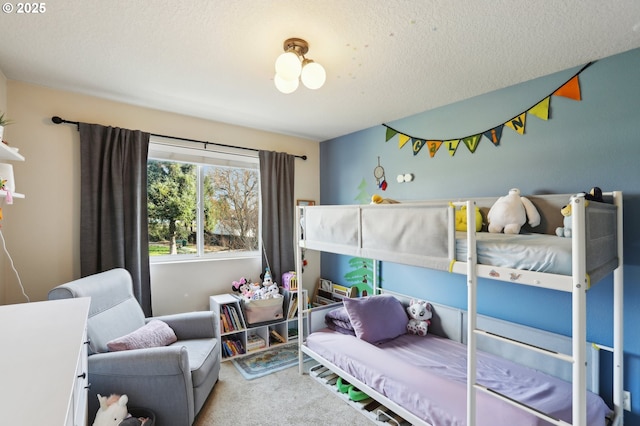 carpeted bedroom with a textured ceiling