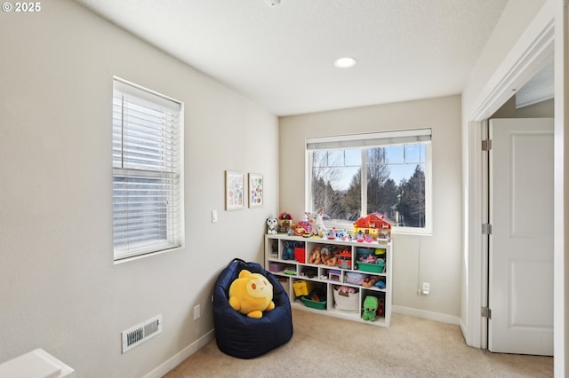 game room with baseboards, visible vents, and carpet flooring