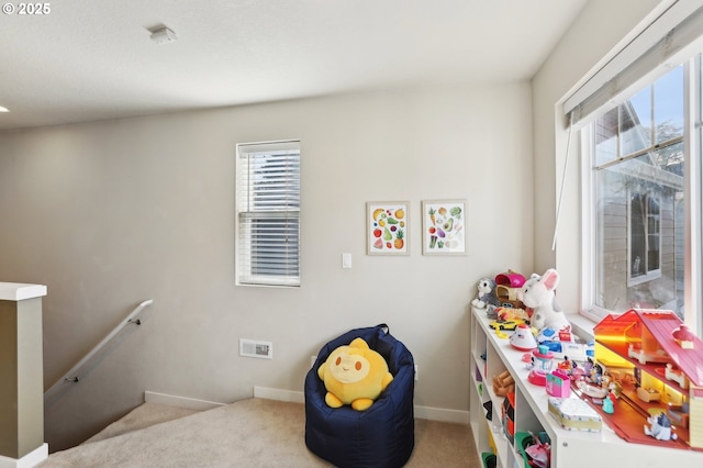 playroom featuring baseboards and carpet flooring