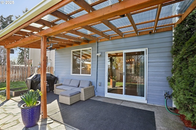 view of patio featuring grilling area, fence, outdoor lounge area, and a pergola