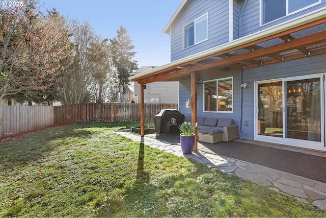 view of yard featuring a patio, a fenced backyard, and an outdoor living space