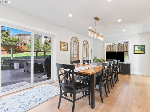 dining space featuring light wood-style floors and recessed lighting